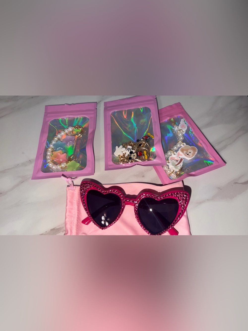 Pink heart sunglasses and Disney charm bracelets